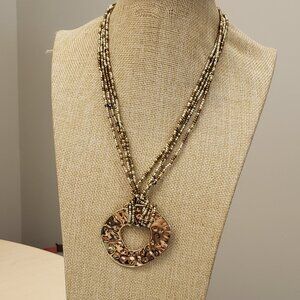 Gold brown sea beads multi strand wrapped gold tone hammered pendant necklace